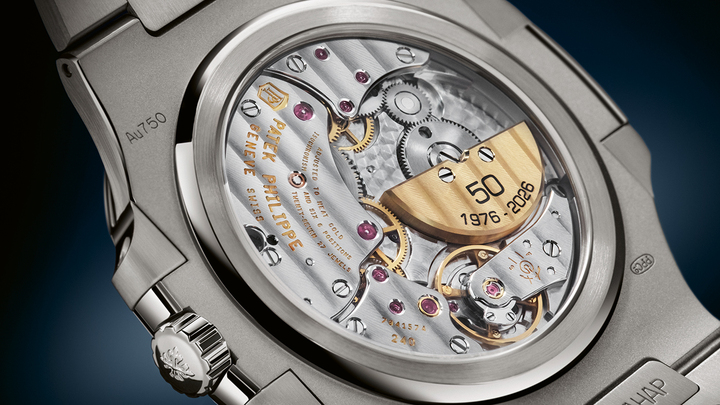 The ultra-thin self-winding 240 calibre with a 22k gold mini-rotor, with the engraved inscription “50 1976 - 2026”