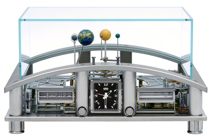 The Richard Mille Planetarium. Astronomical representations and indications: rotation of the earth on its axis, rotation of the earth around the sun, obliquity of the earth, rotation of the moon on its axis, rotation of the moon around the earth, phases of the moon, equation of time, Mercury, Venus, sun. Materials used: titanium, steel, brass, gold, silver, tungsten. The mainspring barrel is designed to have a serviceable life of around 350 years. Each of its parts can be made anew in the future.