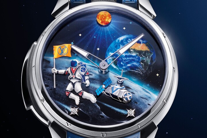 Louis Vuitton's Tambour Taiko Galactique watch (2025). On the left, the sun radiates with an intense crimson glow, achieved through the application of multiple layers of Grand Feu enamel and enhanced by minute fragments of gold leaf (paillons), delicately applied using the paillonné technique.