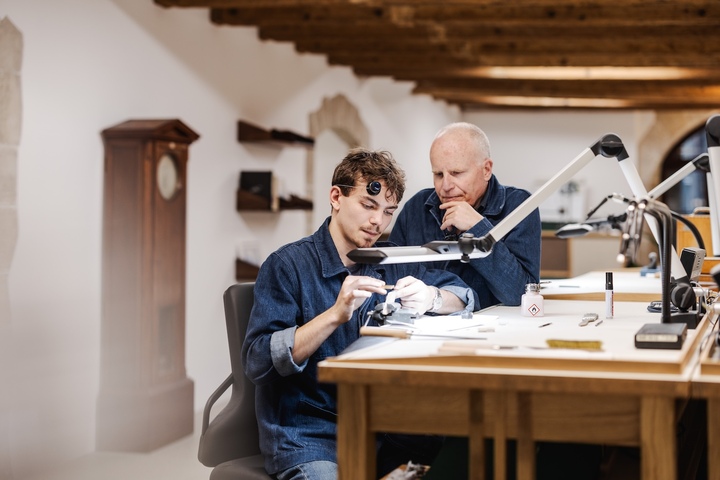 Jean-Marc Figols, who trained Rexhep Rexhepi, now oversees the training of apprentices for his former apprentice's manufacture. Here he is pictured with Eliott, the programme's very first apprentice.