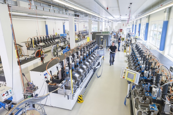 High-precision CNC machining of strip-fed blanks using multi-spindle technology.