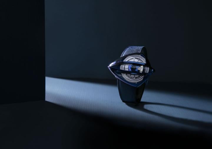 As early as 2008, De Bethune produced the first sapphire crystal hands, encircled by blued titanium, to be fitted on the DB26QP. On the new Dream Watch 5, far from simply carving the case from a single block of sapphire using the traditional methods, master watchmaker Denis Flageollet endeavoured to adapt the sapphire to the watch's titanium case. The team had to insert no wer than seven different sapphire parts – each crafted with unique curves and proportions – which would then be embedded into the blued polished titanium exoskeleton.