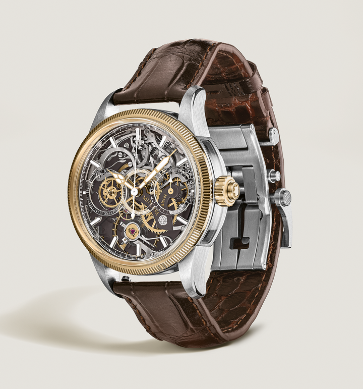 Montblanc's latest 1858 The Unveiled Minerva Chronograph showcases the Manufacture's reversed chronograph movement in a new colour scheme which sees the addition of a yellow gold 750/1000 (18 karat) fluted bezel and brown-coated bridges and plates that complement the yellow gold-coloured gear train on the movement. Like the MB M16.26, this monopusher calibre has been flipped over to display all the mechanical action on the dial side of the watch. At first glance, the viewer may think it is a skeletonised movement, but a closer look reveals that this chronograph movement is on full display on the dial side. 