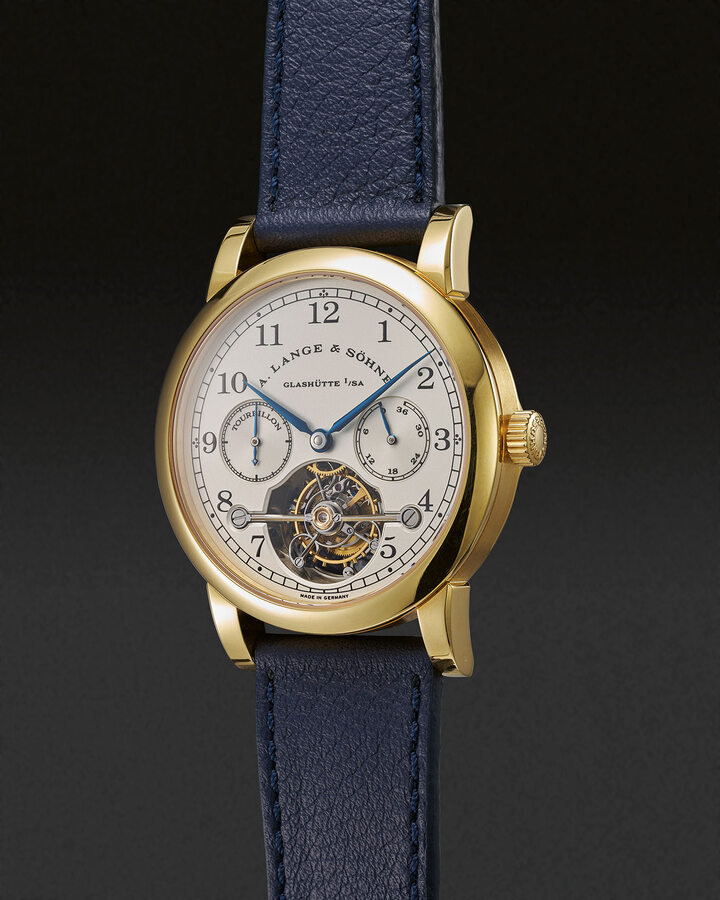 A. Lange & Söhne Glashütte i.Sa., ref. 701.001, Tourbillon “Pour le Mérite” with power reserve indication m. no. 406, c. no. 110323. Limited edition in yellow gold no. 73/150. 1998. Signalling the brand's revival, this was the first wristwatch to incorporate a fusee-and-chain transmission.