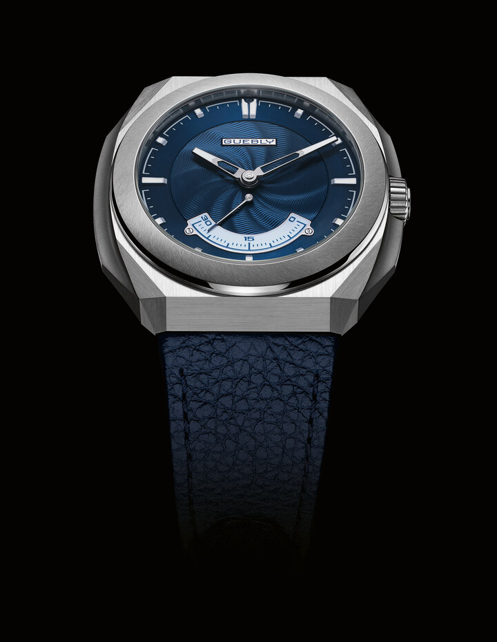 The CH1 Rétrograde's dial showcases artisanal excellence at its purest. Hand-guilloché on a 925 sterling silver base, it reveals a spiral motif inspired by wind-shaped dunes – offering subtle, dynamic depth. Light dances across its surface, accentuating each undulation with finesse. The retrograde appliqué in white gold features champlevé Grand Feu enamel by Maëlle Constant, a specialist in this age-old technique. 