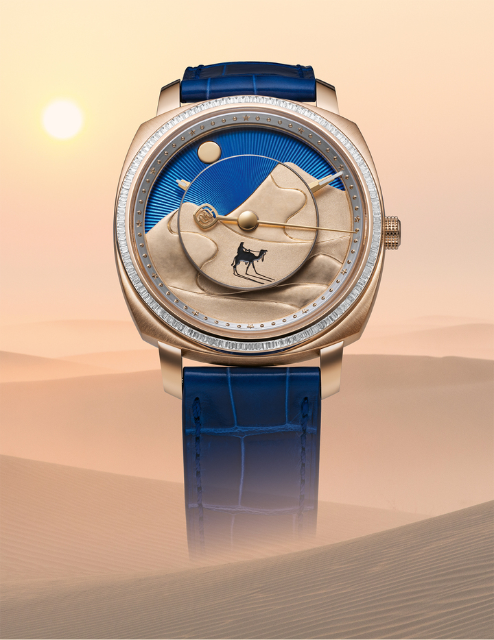 Beyond its mechanical complexity, Nour La Lumière is defined by the craftsmanship invested in every detail of its Day/Night display. The rotating disc is engraved entirely by hand, motif after motif, with dunes, moon and stars rendered in delicate bas-relief. At its centre, a dromedary appears in miniature hand-painting, executed using brushes composed of only a handful of bristles on a surface measuring just a few millimetres across.