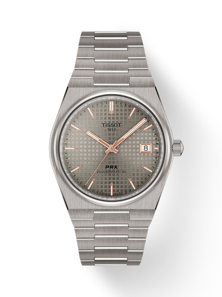 The new Tissot PRX Powermatic 80 is a tribute to enduring style, technical mastery and the subtle poetry of fine materials. Titanium captivates with its feather-light strength and commanding presence, while Damascus steel enchants with unique patterns that seem to capture the flow of time itself.