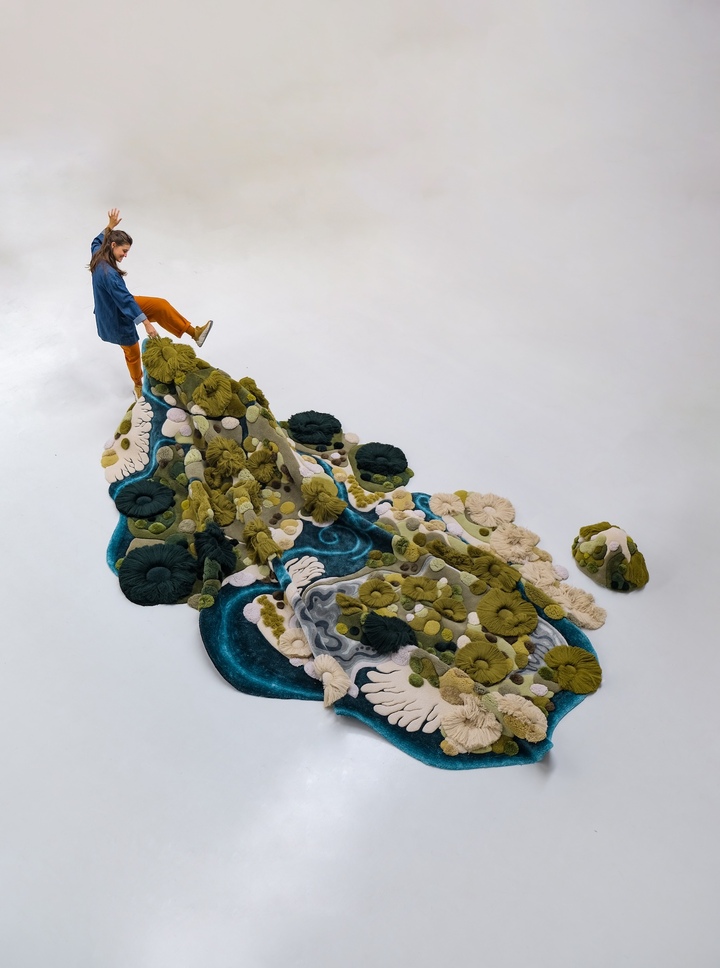 Vanessa Barragão, *Dunedin*, 2024. Hand-tufted wool rug, 4.5 × 3.7 m. Inspired by a stay in Ōtepoti Dunedin, on New Zealand's South Island, the work translates the region's waters, beaches and grassy hills into sculpted wool reliefs; the “hills” are removable and can be used as seats or backrests.