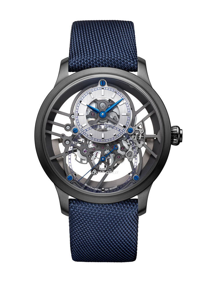 The Grande Seconde Skelet- One Ceramic's movement features blued steel screws to join the 18-karat white gold hour circle and the sapphire dial. The movement plate stretches all the way around the case, which itself does away with the casing ring. With this new construction, the gear train is entirely suspended and fixed to the skeletonised bridges that cross over the movement.