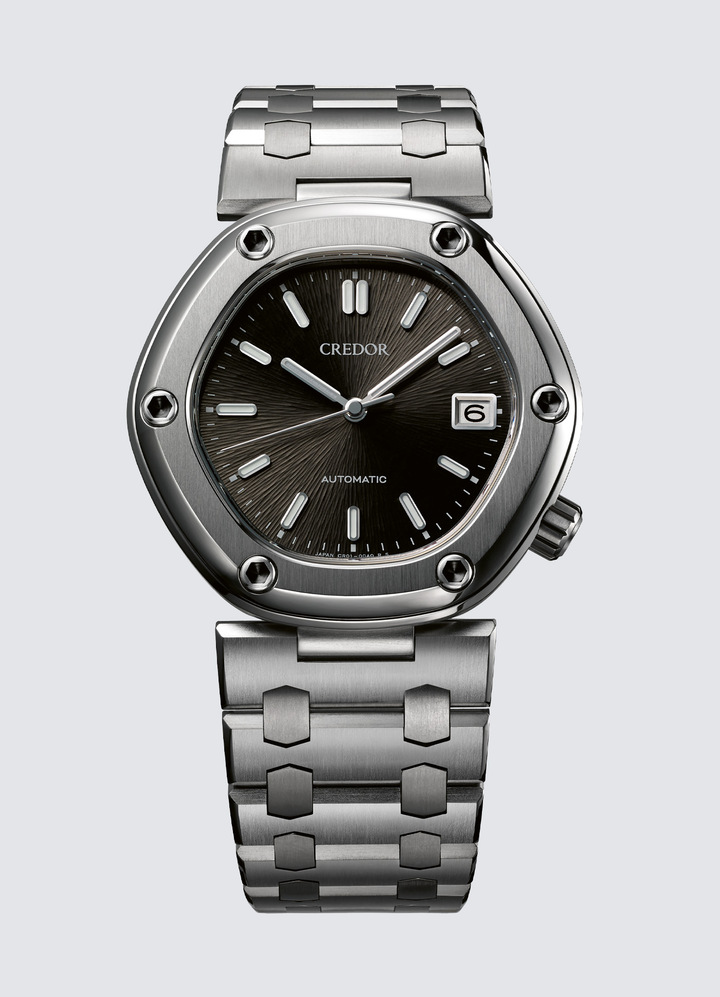 Credor Locomotive Limited Edition The collaboration between Seiko and Gérald Genta, who had a deep love of Japan, began back in the 1970s. The name, Locomotive, that Genta chose for this hexagonal watch – so characteristic of his style – was based on “the hope that it would be a driving force” for the newly created Credor. This new edition scrupulously reproduces Genta's codes while adapting them to today's more advanced techniques. For example, the six screws around the bezel are no longer decorative, but functional. The case and bracelet are made in high-grade, meticulously polished titanium. The textured dial pattern, inspired by steam locomotives, is made up of 1,600 radial lines engraved directly on the dial by means of a specially designed mechanical process to give the appearance of hand-engraving. And unlike Genta's original Locomotive, which was quartz-driven, this watch is powered by a new, automatic movement, exclusive to Credor, which is less than 9mm thick.